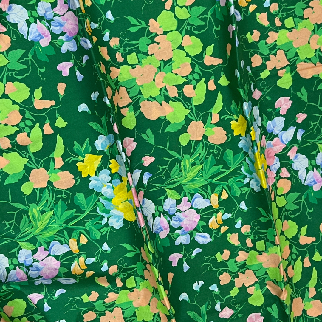 Vibrant Floral Harmony on nourishing green fabric