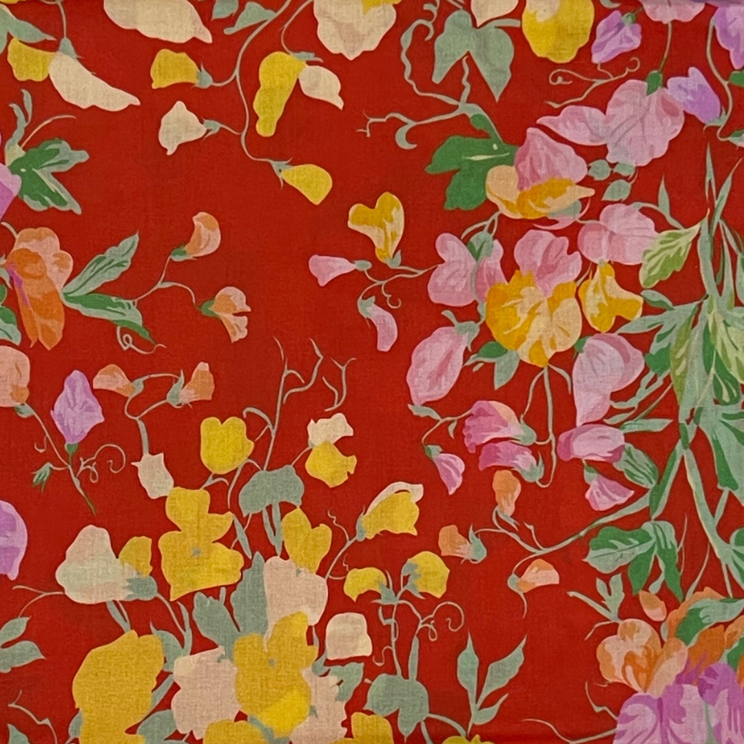 Vibrant Floral Harmony on lively Red fabric