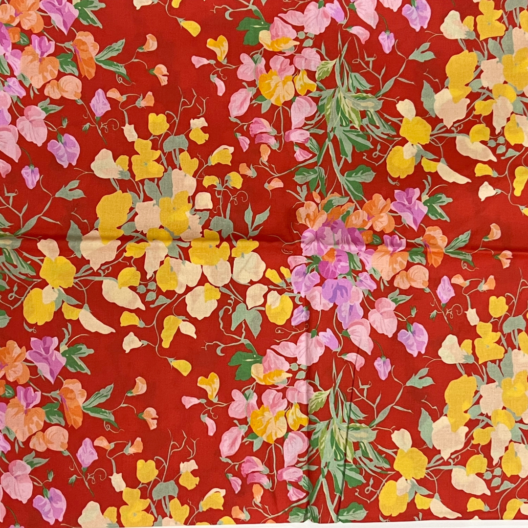 Vibrant Floral Harmony on lively Red fabric