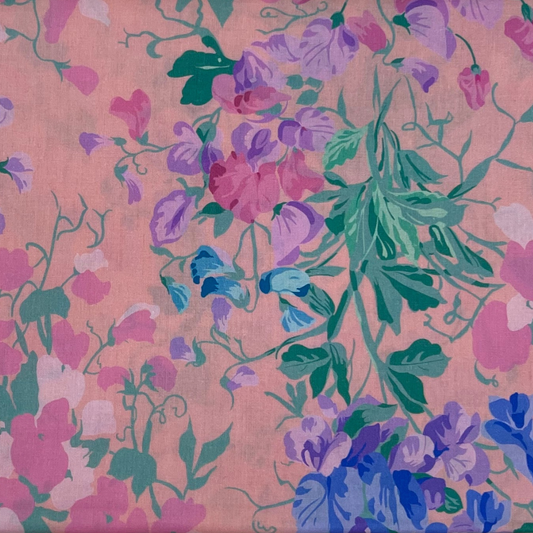 Vibrant Floral Harmony on Soft Pink fabric