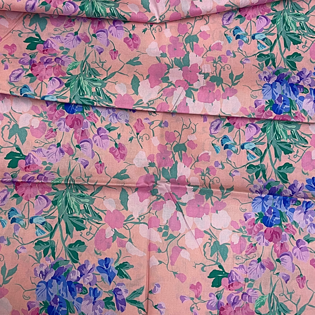 Vibrant Floral Harmony on Soft Pink fabric